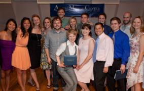 Vet interns posing for a photo at their graduation ceremony