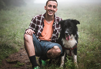 A young man with a dog