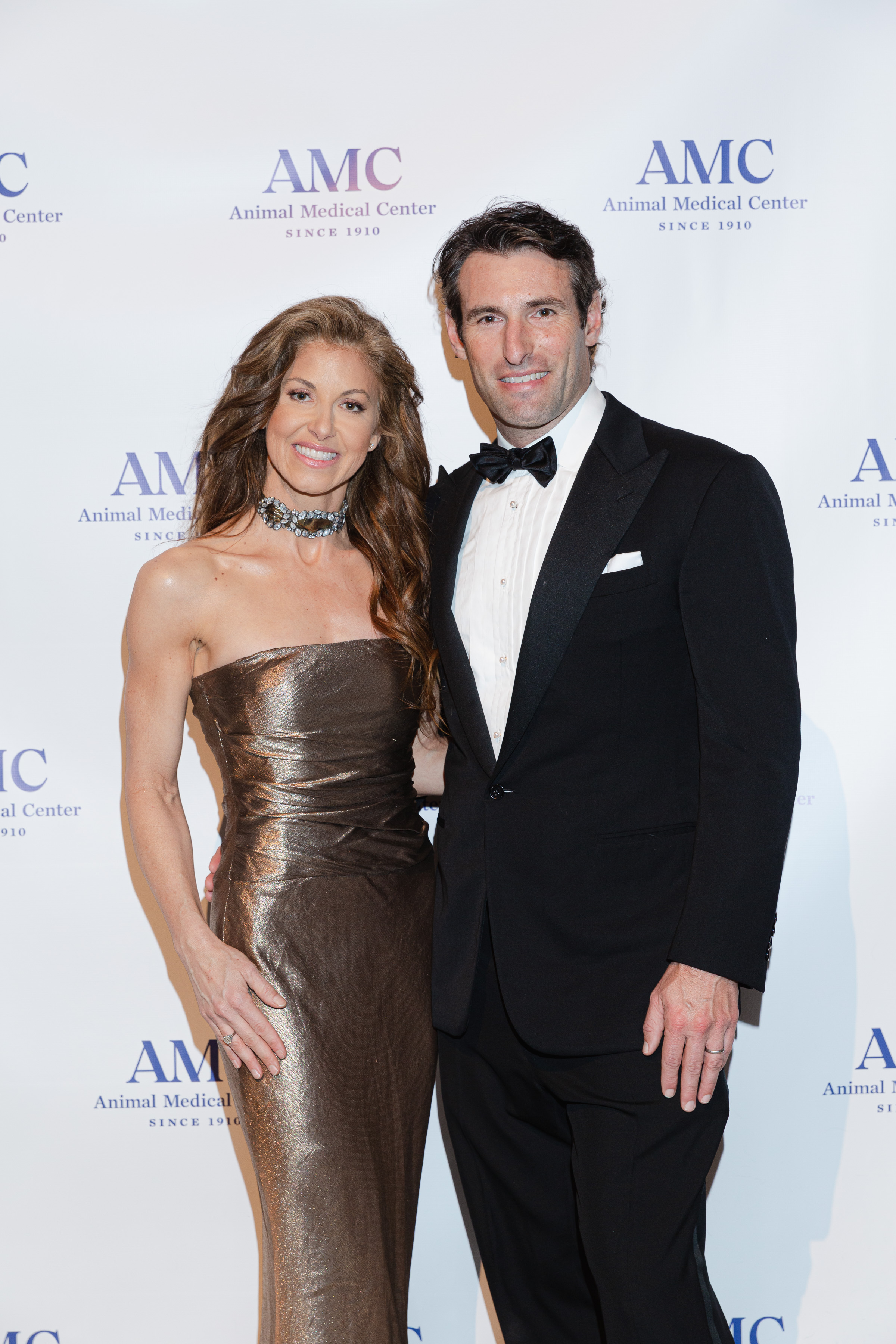 Dylan Lauren poses with her husband in front of an AMC backdrop