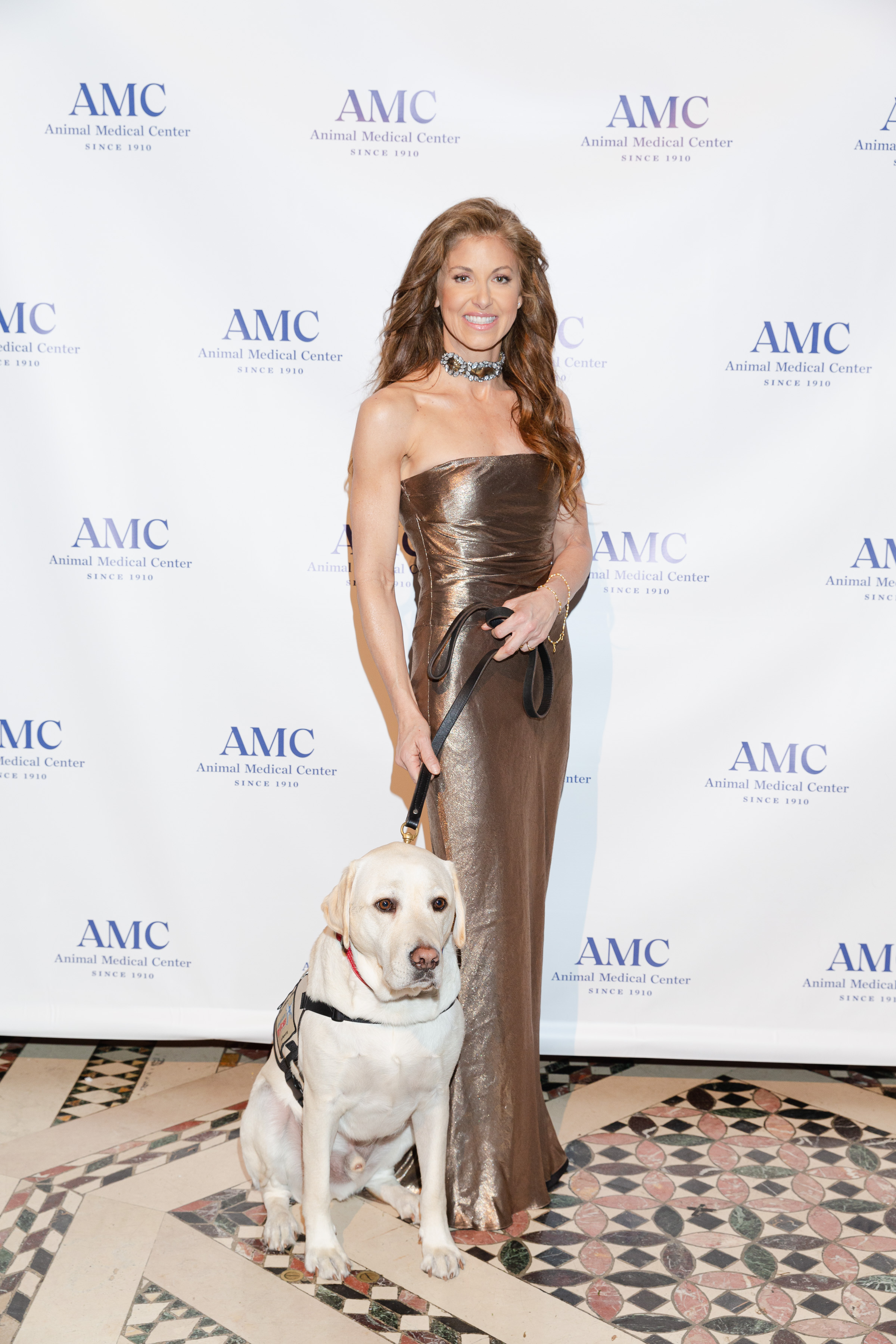 Dylan Lauren and service dog Sully H.W. Bush pose at AMC's Top Dog gala