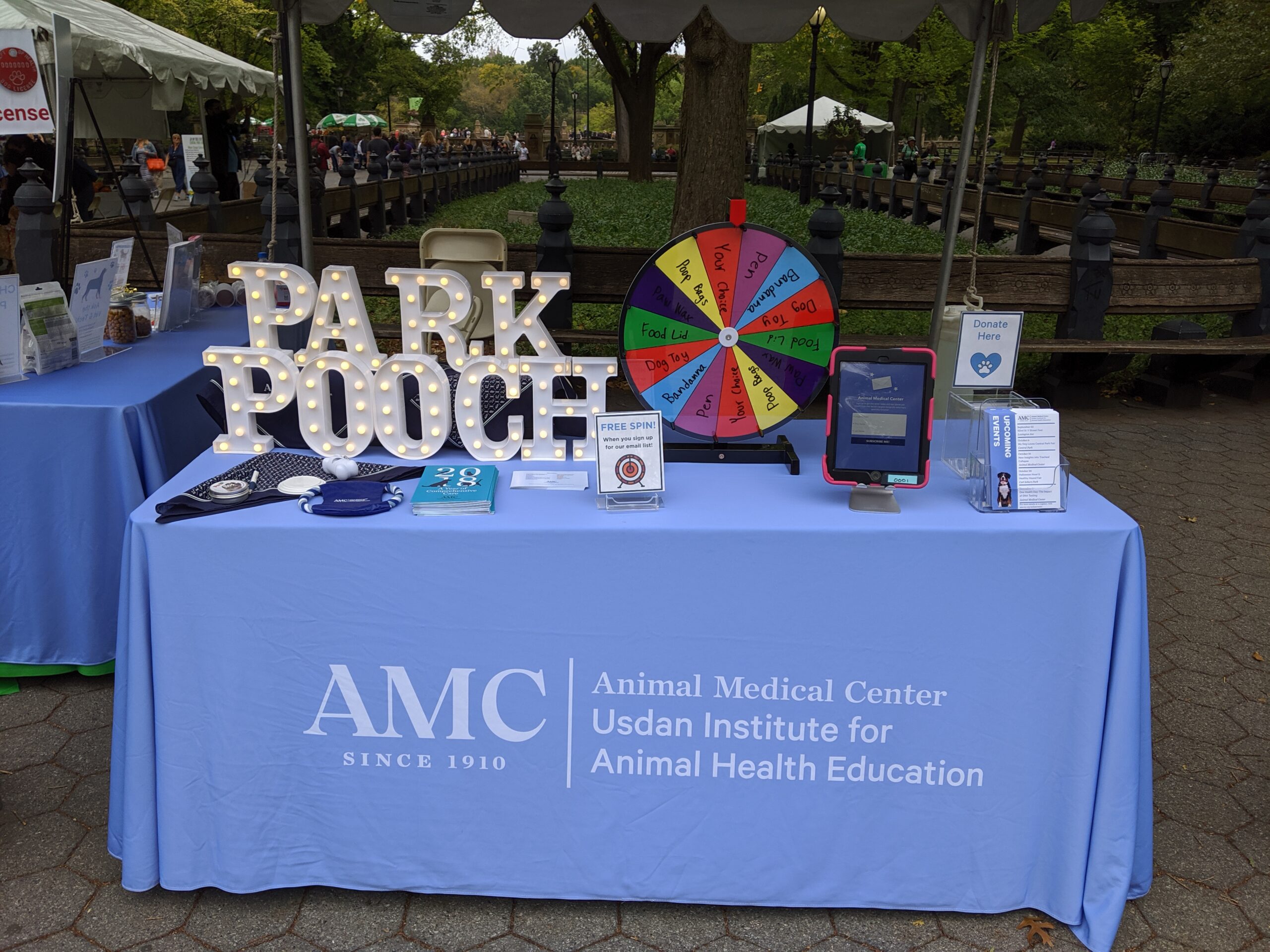 AMC table with prize wheel at My Dog Loves Central Park Fair