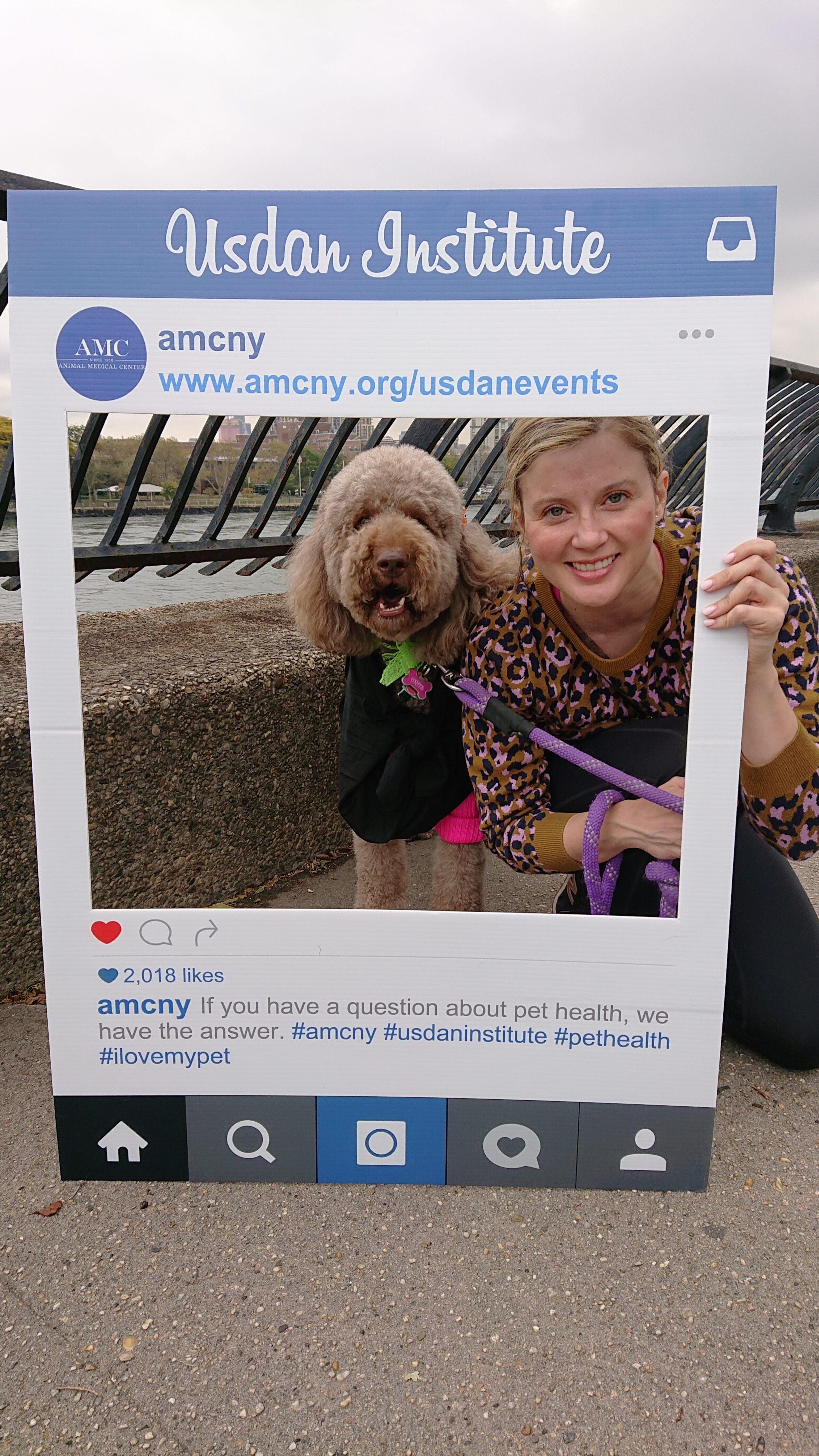 Woman posing with dog in a costume