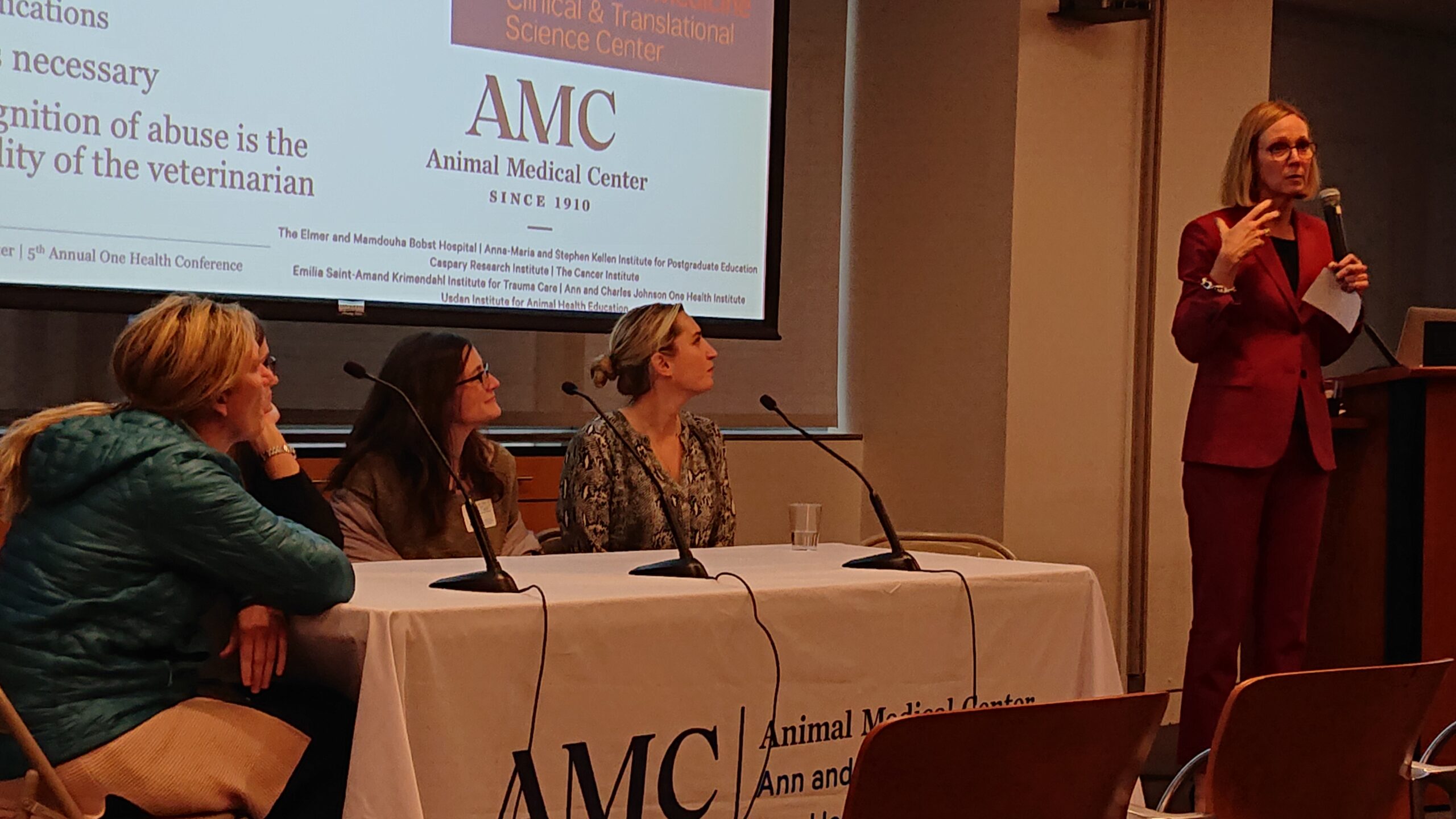 Dr. Bazzle, Dr. Keyserling, Dr. Cazzoli, and Dr. Zollo sitting at table for panel with Dr. Quesenberry as the moderator