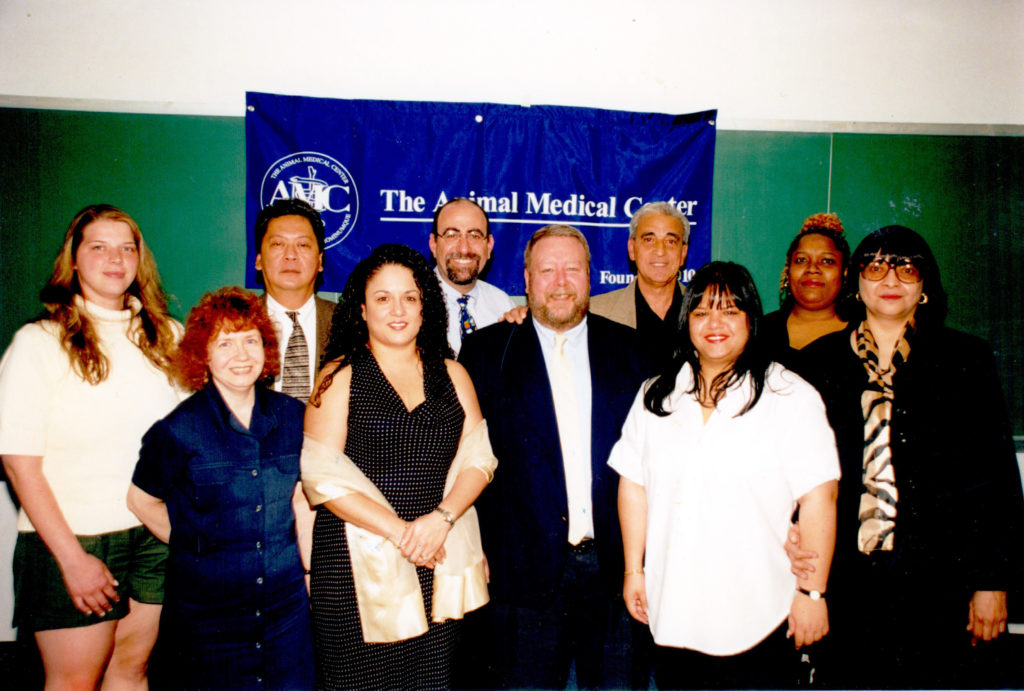 AMC employees pose for group photo at an appreciation event in 2002