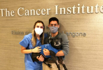 Dr. Laura Chadsey with her dog at AMC Cancer Institute