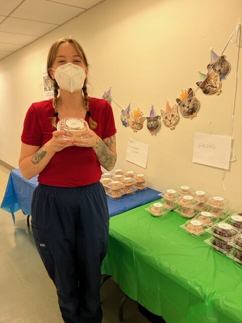 A veterinary assistant with a cupcake