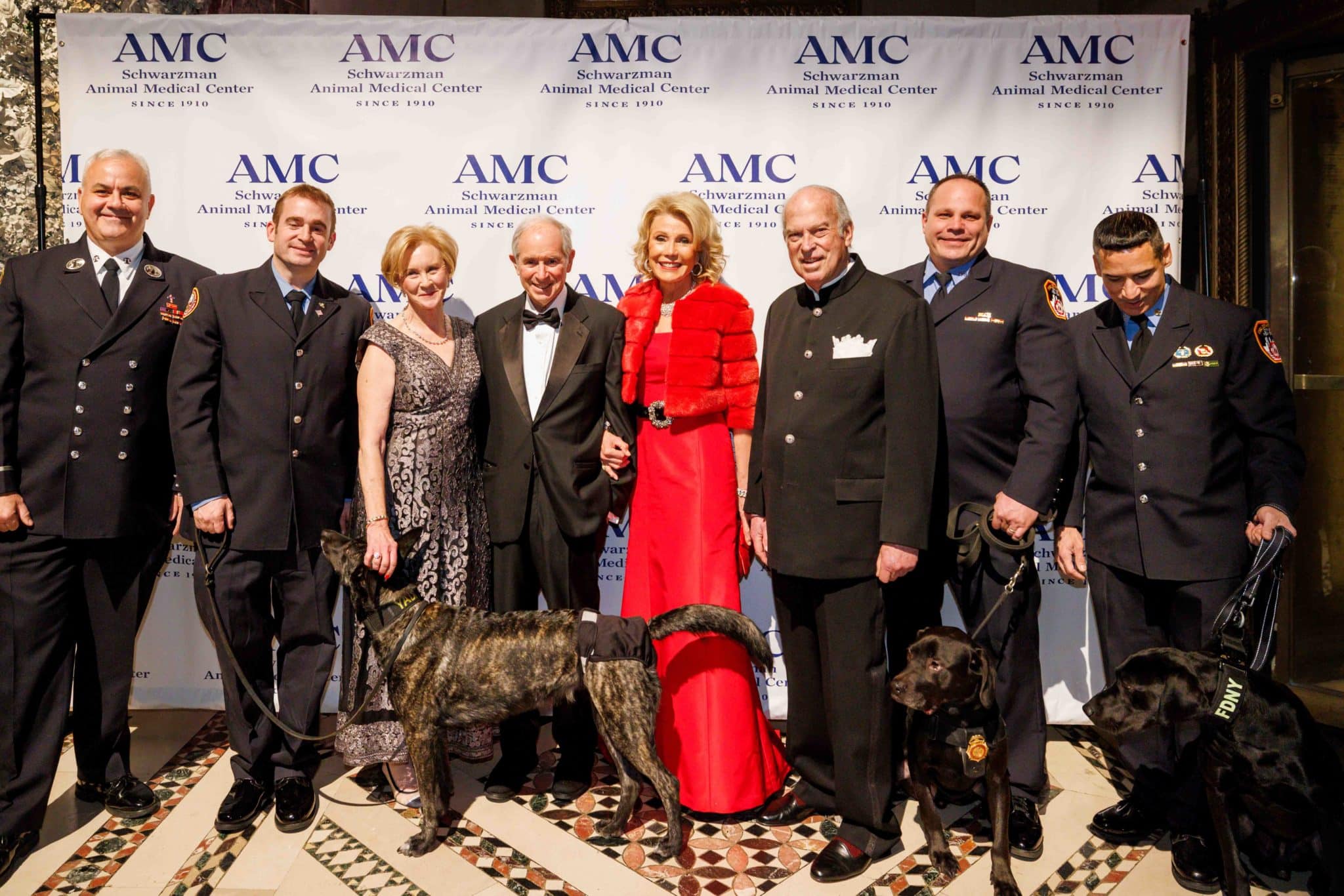 Kathryn Coyne, Stephen and Christine Schwarzman, and members of the FDNY K9 Unit at AMC's Top Dog Gala