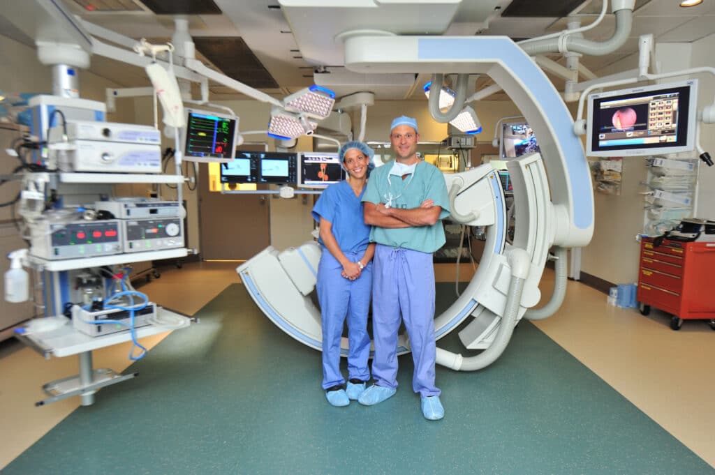 Two veterinarians in front of an operating table