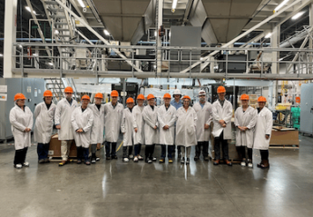 A group of veterinarians touring a pet food manufacturing plant