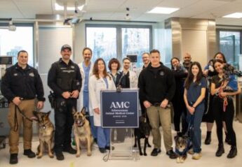 Veterinarians and clients celebrate the opening of AMC's new surgical center