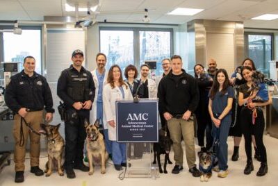 Veterinarians and clients celebrate the opening of AMC's new surgical center