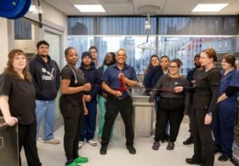 AMC Staff cuts a ceremonial leash to open its new MSU ward
