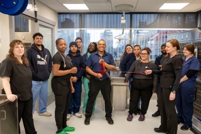 AMC Staff cuts a ceremonial leash to open its new MSU ward