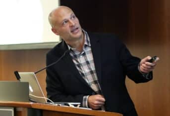 AMC's Dr. Chick Weisse presenting a lecturn