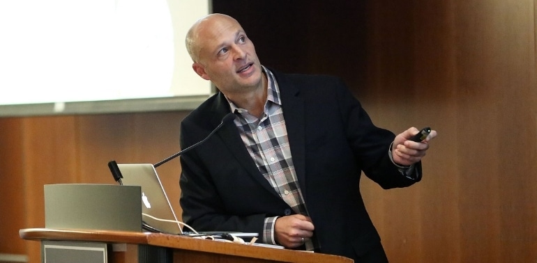 AMC's Dr. Chick Weisse presenting a lecturn